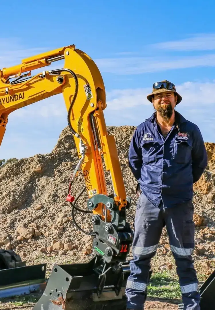 Australian Trenching and Excavations team member with Hyundai excavator